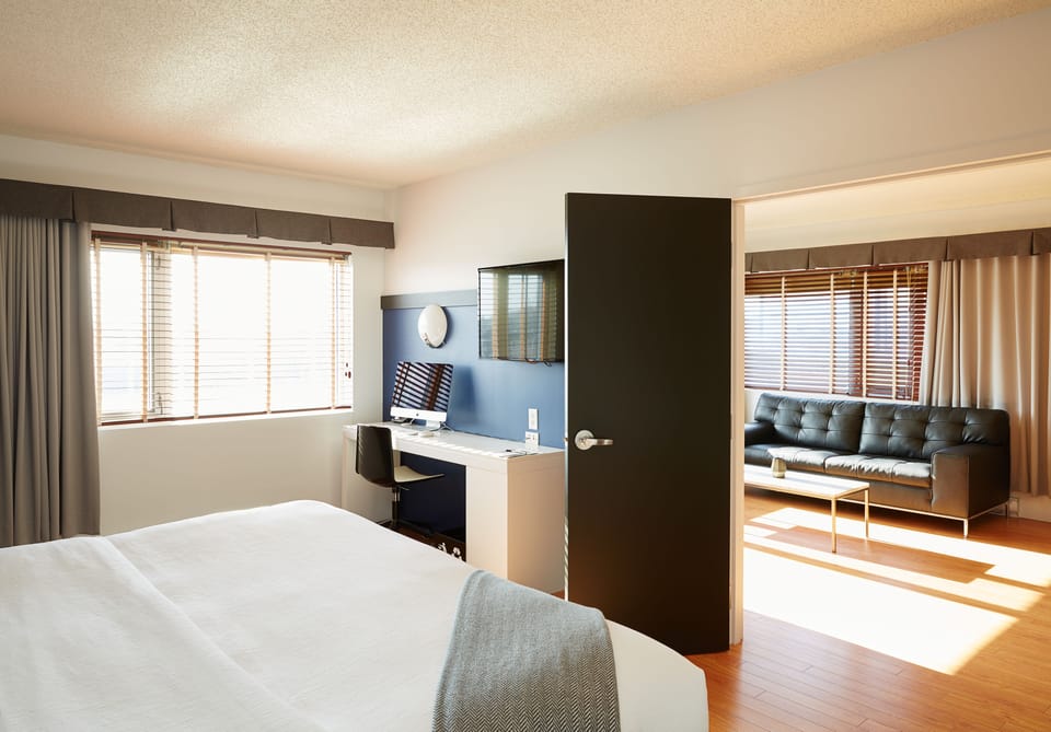 Deluxe Suite, 1 King Bed | In-room safe, desk, laptop workspace, blackout drapes