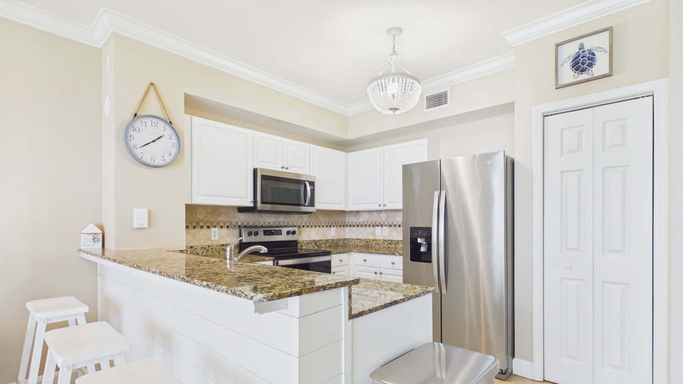 Fully applianced kitchen with all the cooking essentials + breakfast bar seating