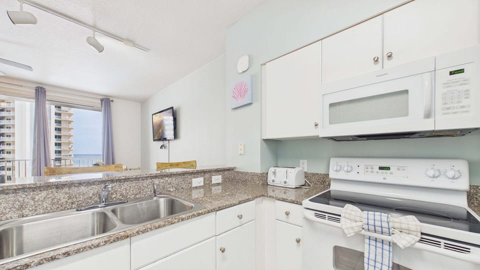 Ample counter space in kitchen with dual basin sink