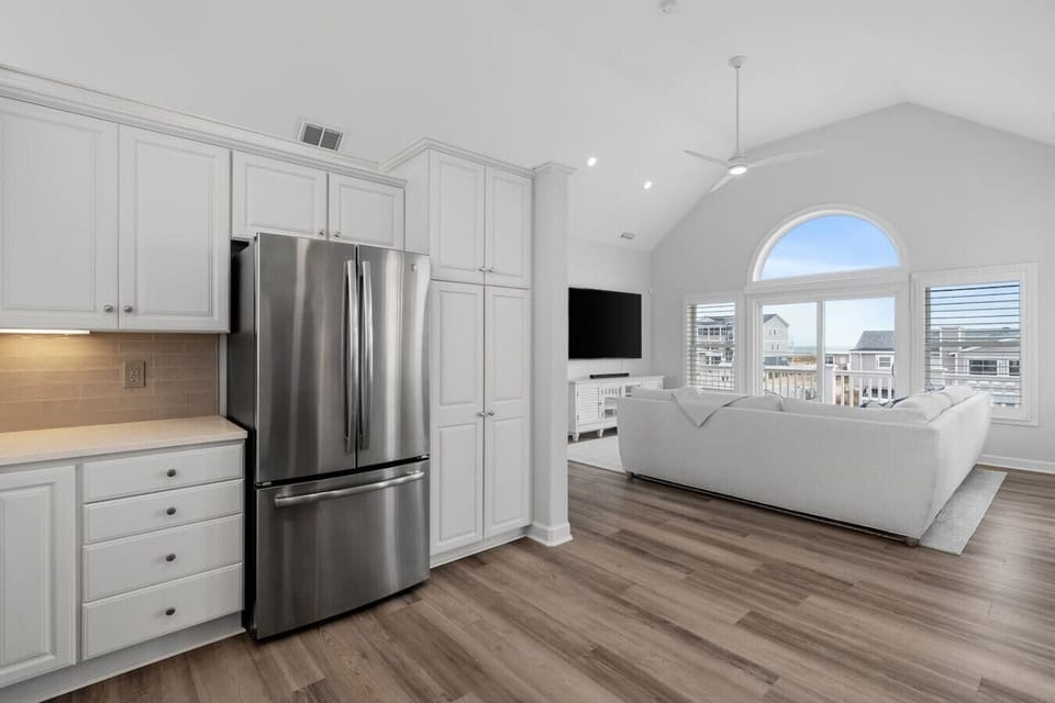 Open-concept kitchen flowing seamlessly into the living area—ideal for group stays, entertaining, and family meals.
