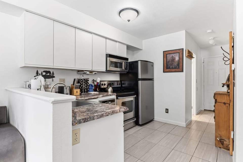 Your fully equipped modern kitchen features granite counters, stainless appliances, and everything you need for home-cooked meals.