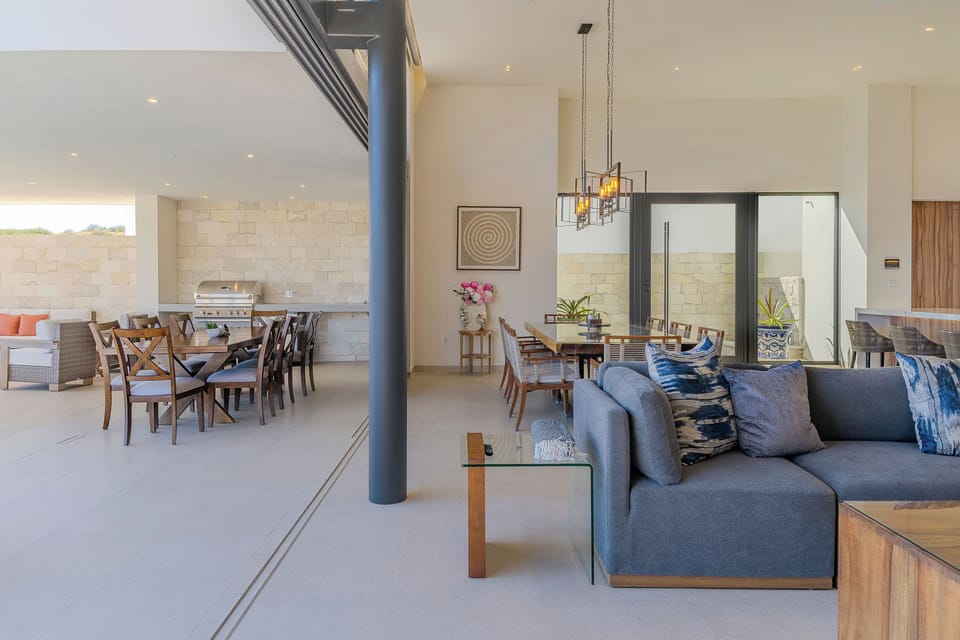 Your spacious living area flows seamlessly into the dining space, where comfortable sofas invite you to unwind after exploring.