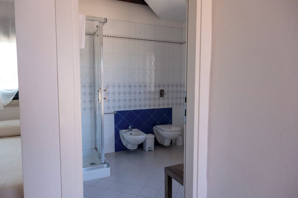 Comfort Room, Garden View | Bathroom | Hair dryer, towels, soap, shampoo