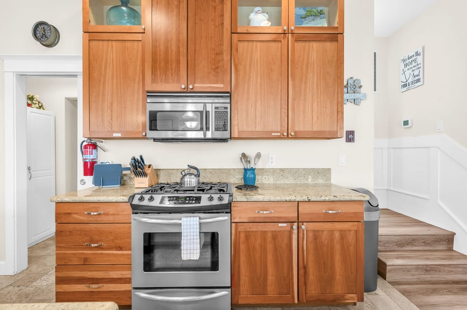 Your fully-equipped kitchen awaits with granite counters, stainless appliances, and everything needed to create memorable meals during your stay.
