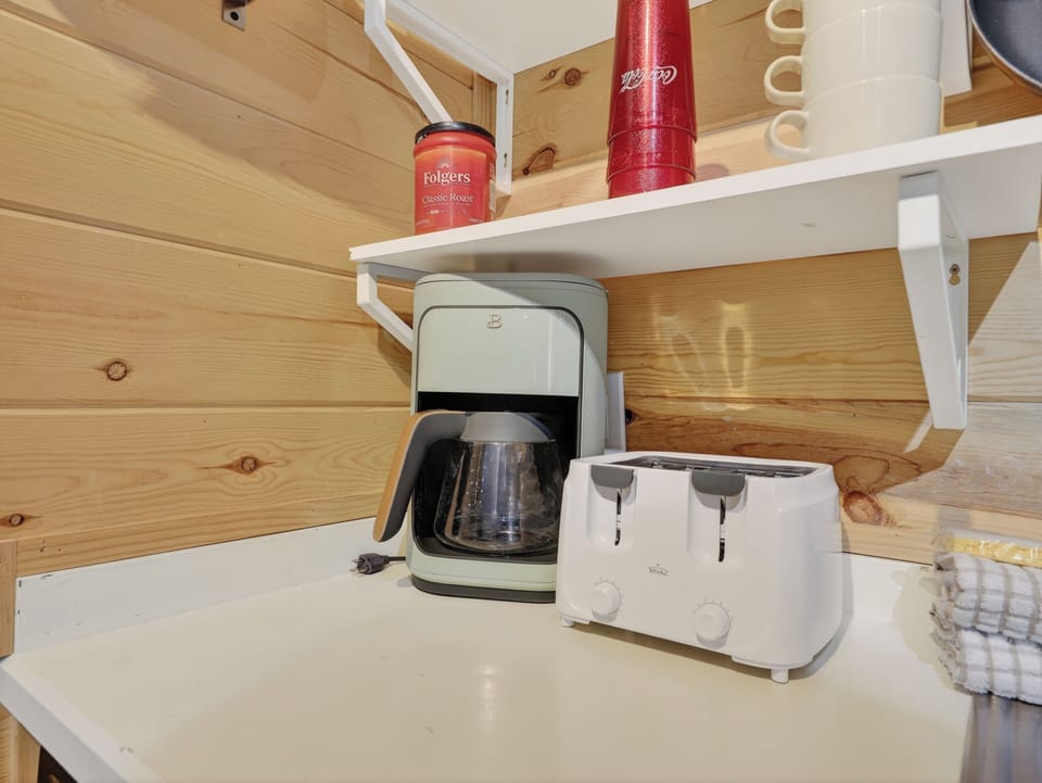Start your mornings with fresh coffee and perfectly toasted bread from your well-equipped kitchen station.