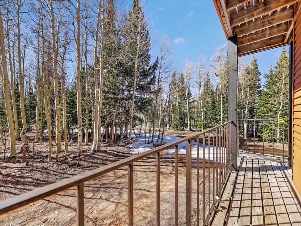 Step onto your private deck and breathe in the crisp forest air while gazing at towering aspens and evergreens.