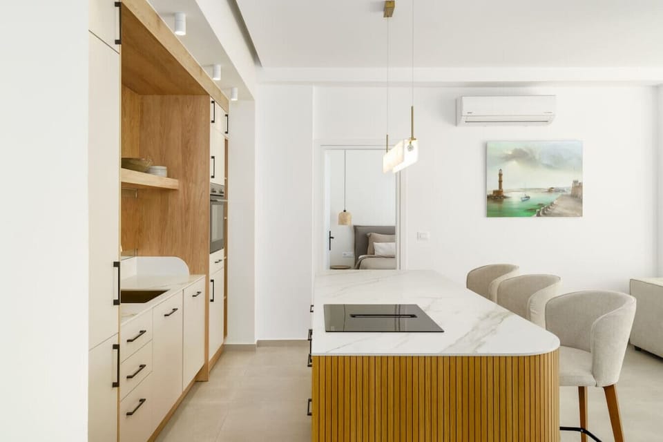 Fully equipped kitchen with sleek design and dining area