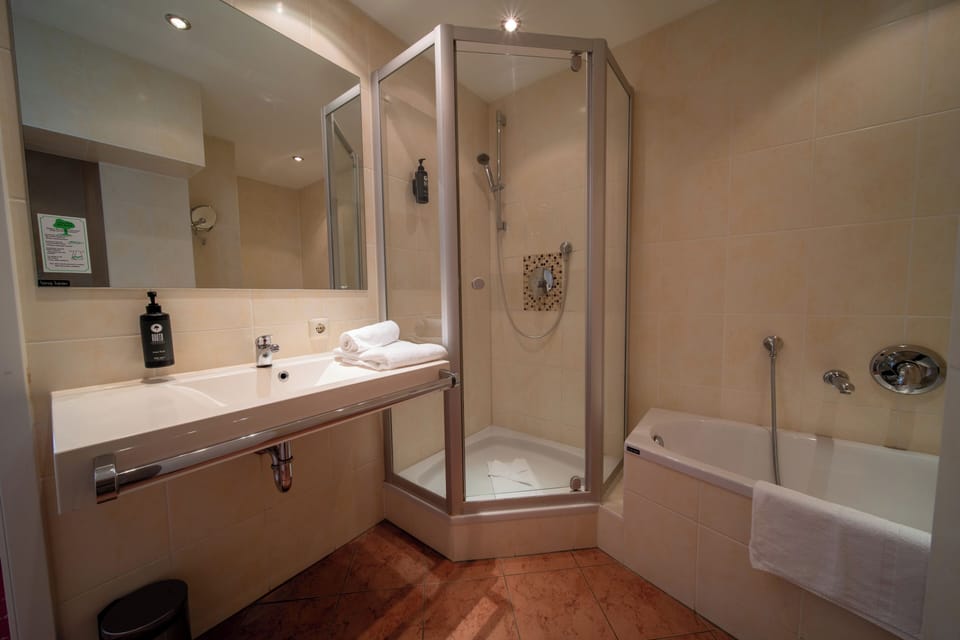 Family Suite | Bathroom | Hair dryer, towels, soap, shampoo