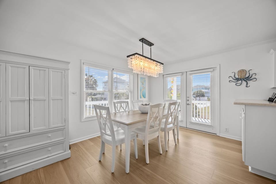 Bright dining area with seating for family meals and easy access to the balcony