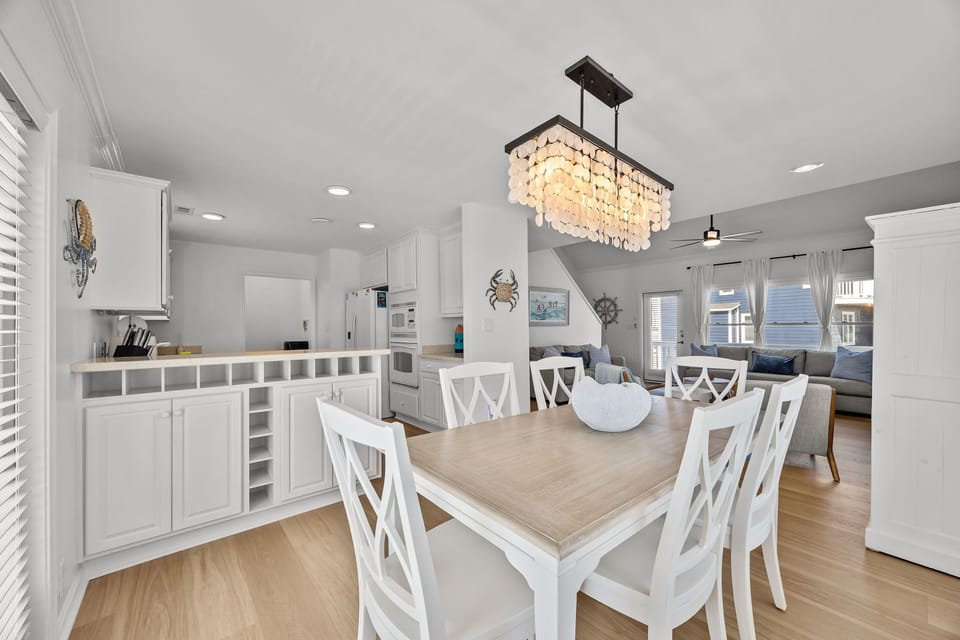 Open dining space connected to the kitchen and living area, perfect for gathering and entertaining