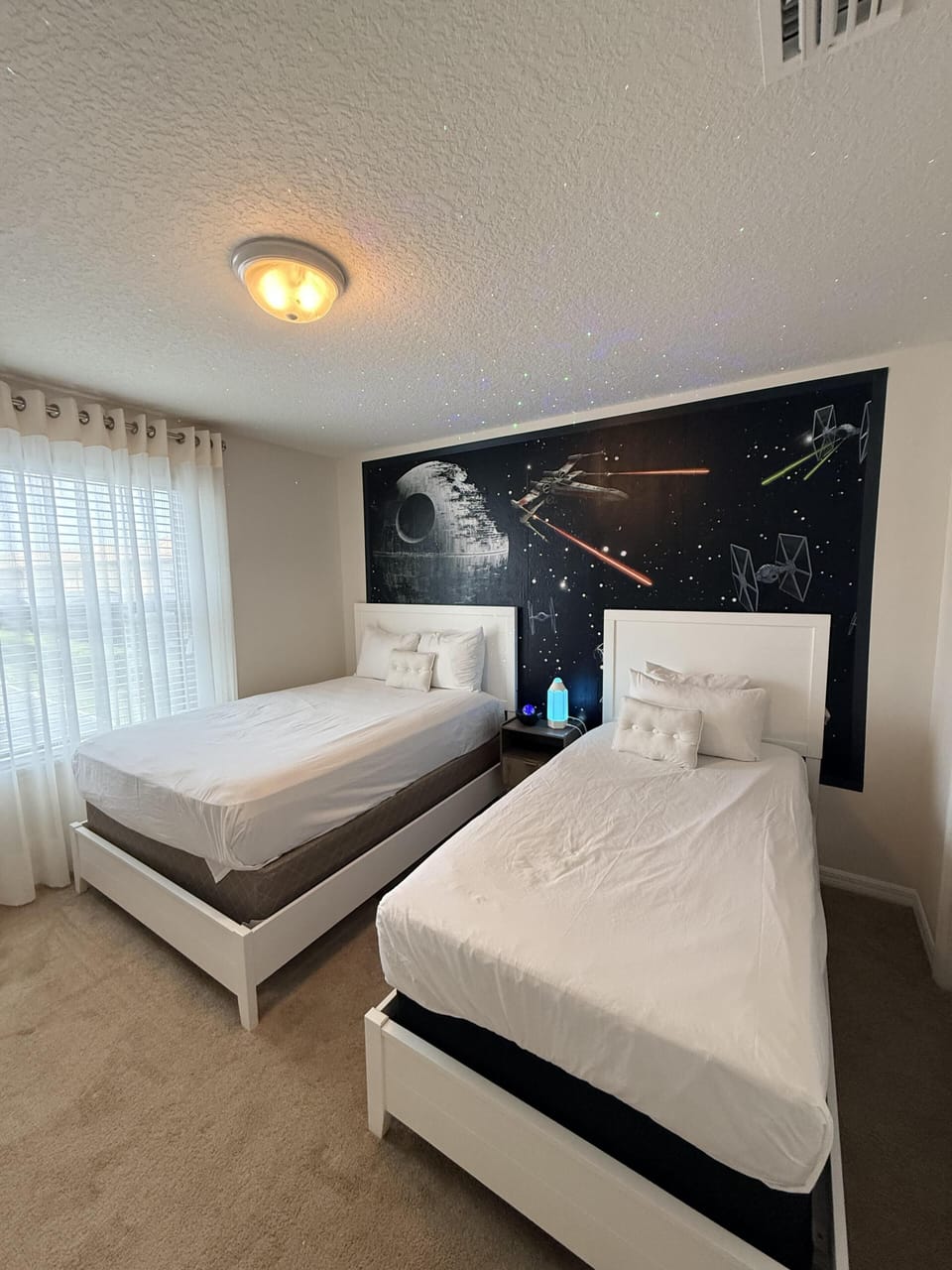 Bright and cozy twin bedroom with space for everyone