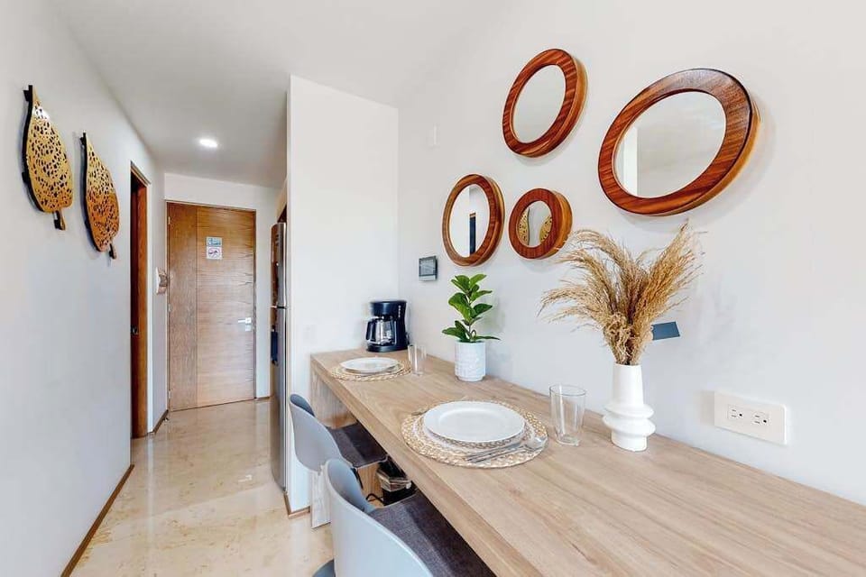 Dining area with decorative mirrors