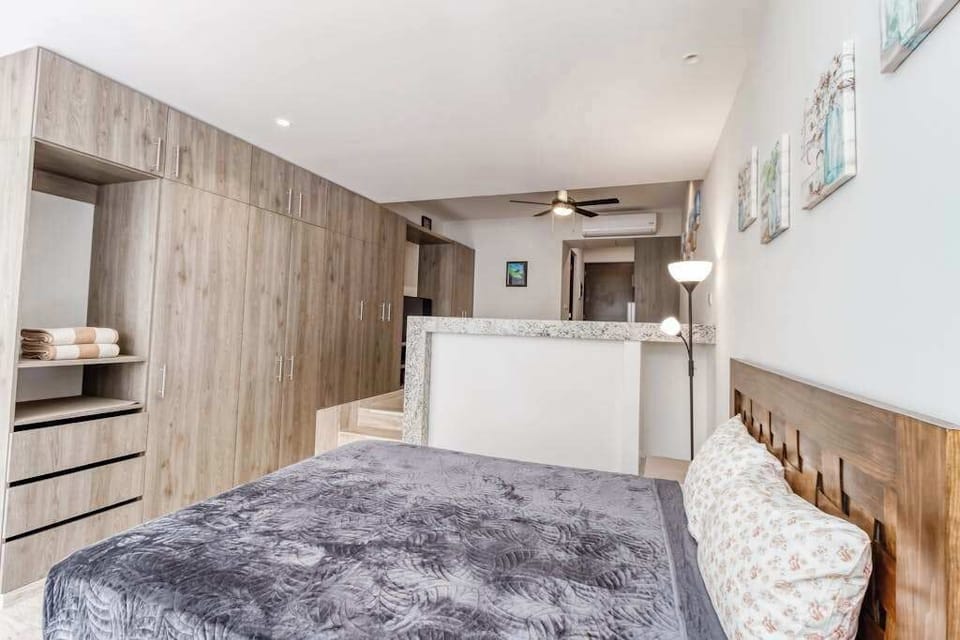 Studio sleeping area with queen bed