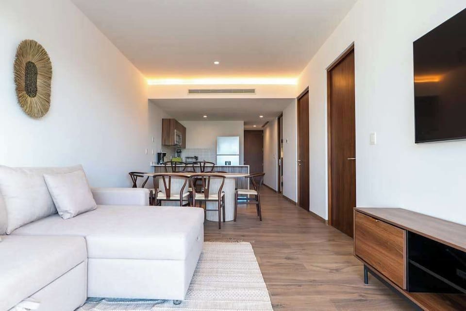Open living room with adjoining kitchen