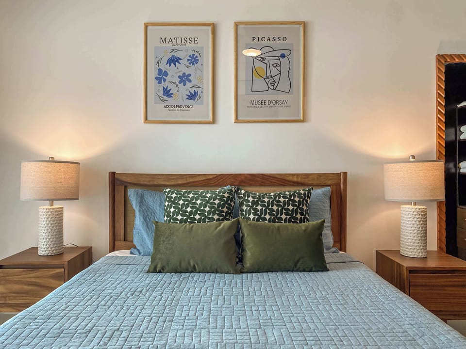 Studio sleeping area with double bed and decor