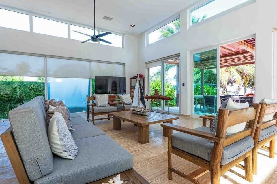 Open-plan living and dining area with double-height ceilings