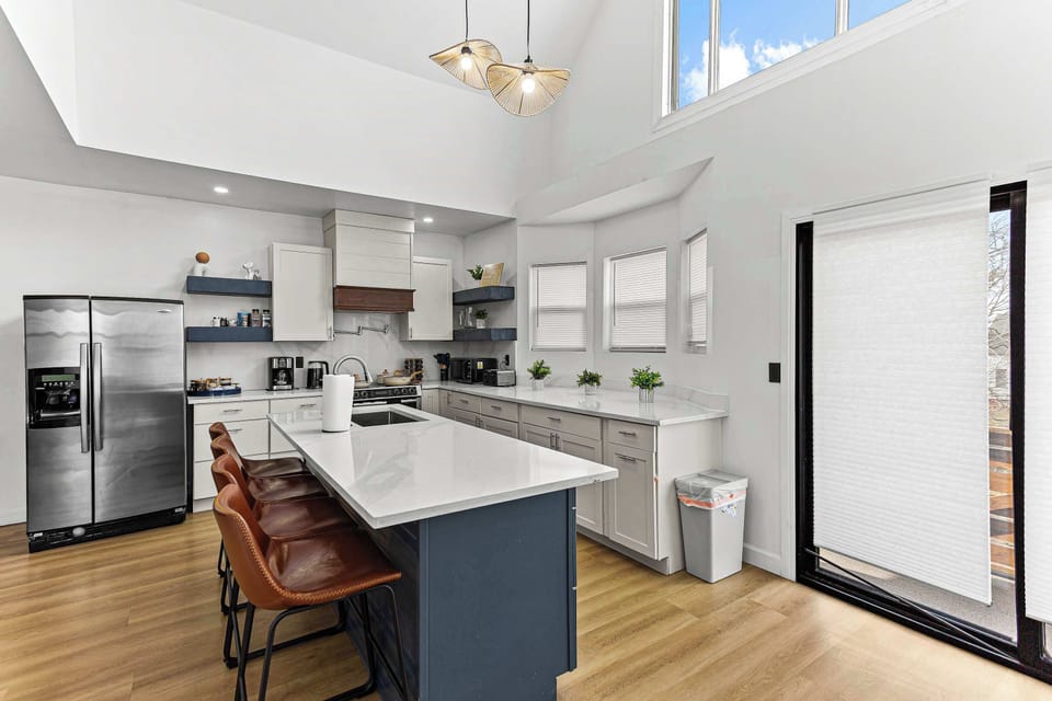 Bright and spacious kitchen with plenty of room to cook, prepare snacks, or start the day with coffee.