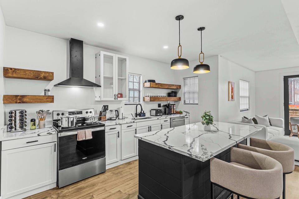 A stylish and functional kitchen where you can enjoy cooking and dining in comfort with ample space for all your meal prep needs.