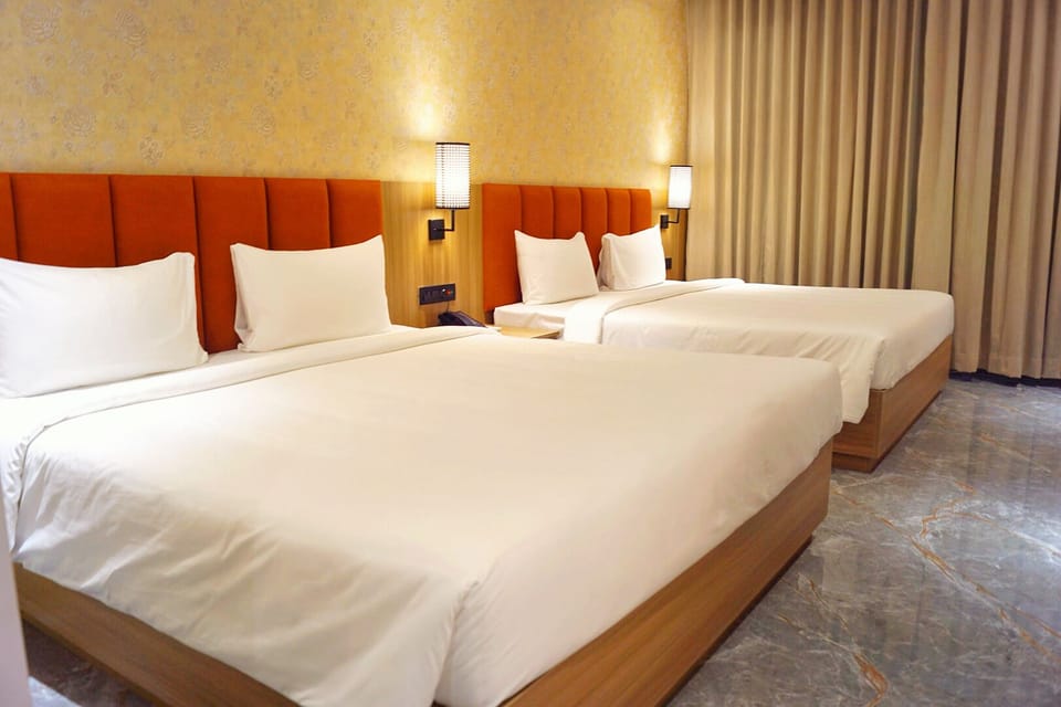 Deluxe Quadruple Room, 2 Queen Beds | In-room safe, WiFi (free)