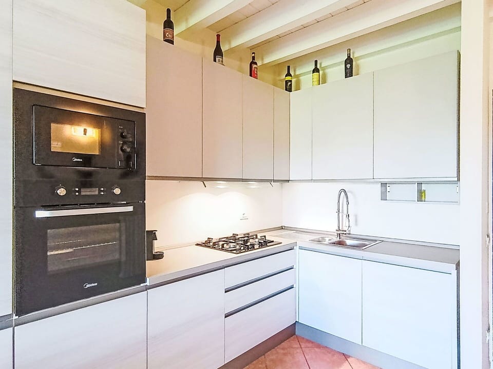 Kitchen Appliance, Kitchen, Countertop, Major Appliance, Kitchen Stove, Cabinetry, Home Appliance, Interior Design, Stove, Wood