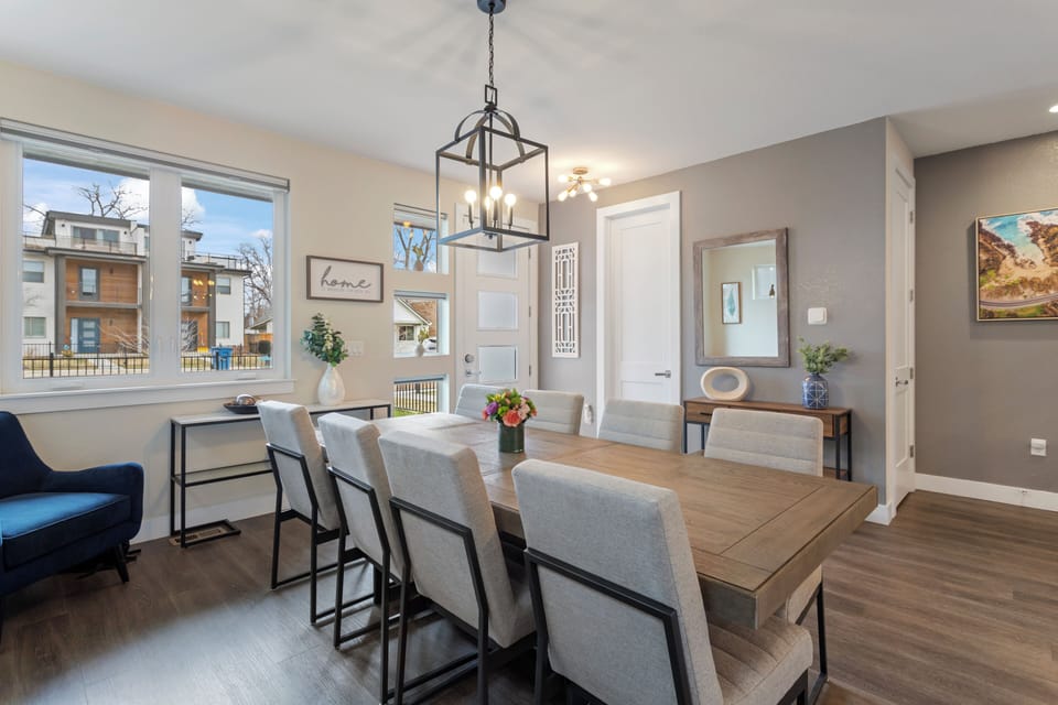 Gather around your elegant dining table for memorable meals, with warm lighting and modern decor creating the perfect atmosphere for your stay.
