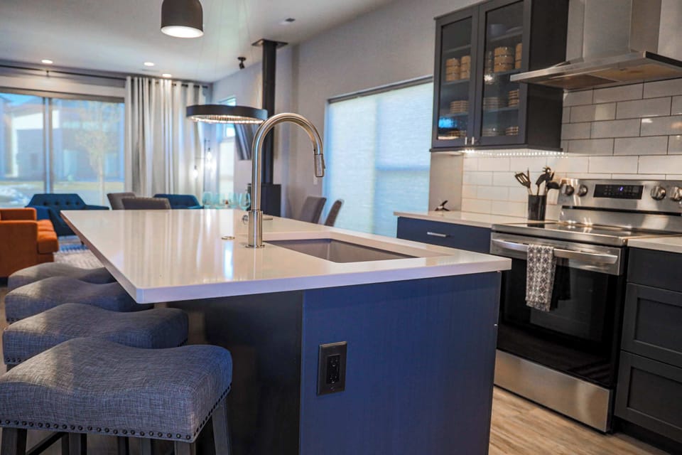 The kitchen is fully stocked, has stunning granite counter tops, new appliances, and a tucked away coffee and wet bar.