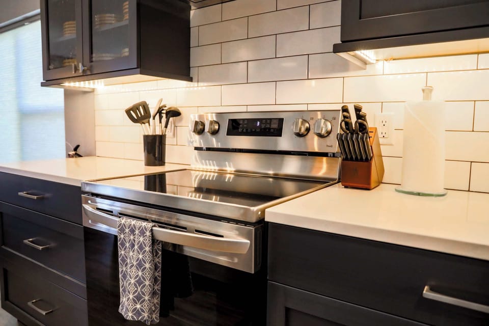 The kitchen is fully stocked, has stunning granite counter tops, new appliances, and a tucked away coffee and wet bar.