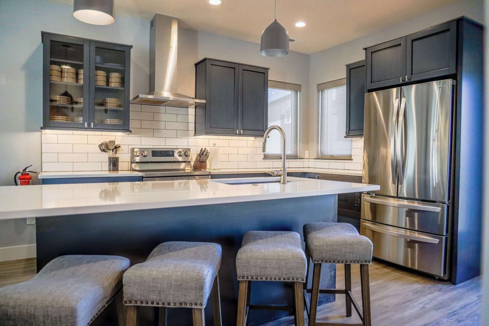 The kitchen is fully stocked, has stunning granite counter tops, new appliances, and a tucked away coffee and wet bar.