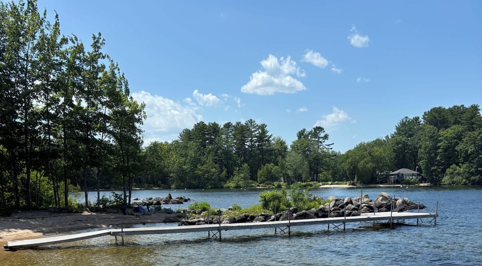 The dock is 60’ long and has an 8’x10’ sitting area at the end with swim ladder