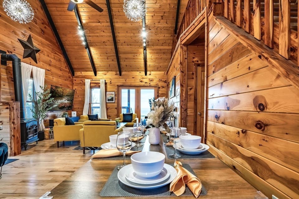 Rustic dining table in a charming mountain retreat, ideal for romantic dinners or family meals.