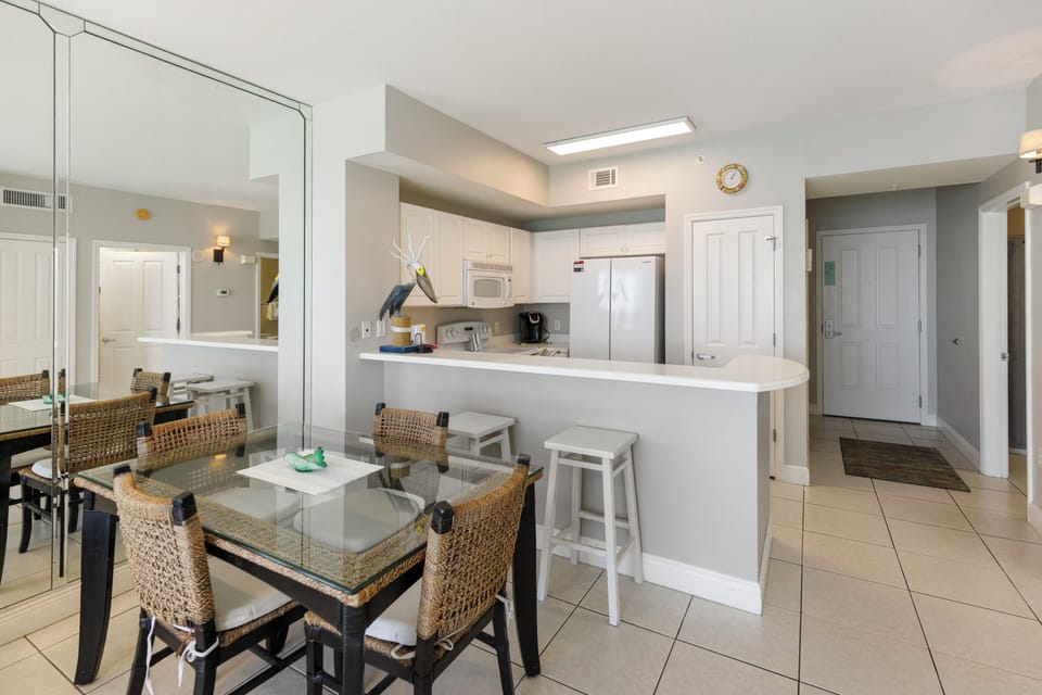 Your bright open kitchen flows seamlessly into the dining area, perfect for preparing meals and sharing stories over morning coffee or evening cocktails.