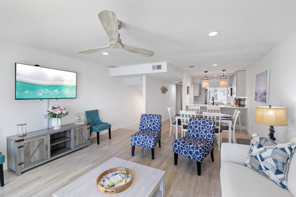 Your bright open-concept living space flows seamlessly into a dining area and fully-equipped kitchen, perfect for gathering and creating vacation memories together.
