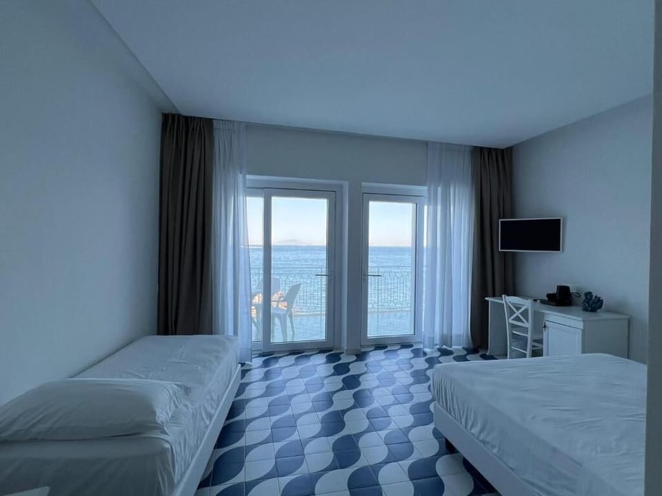 Junior Triple Room, Sea View | In-room safe, blackout drapes, iron/ironing board (on request)