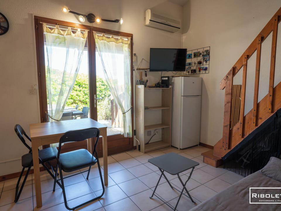 Open-concept living area with a fully equipped kitchen