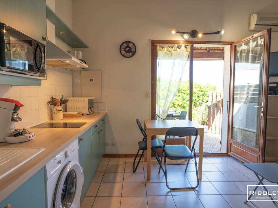 Open-concept living area with a fully equipped kitchen