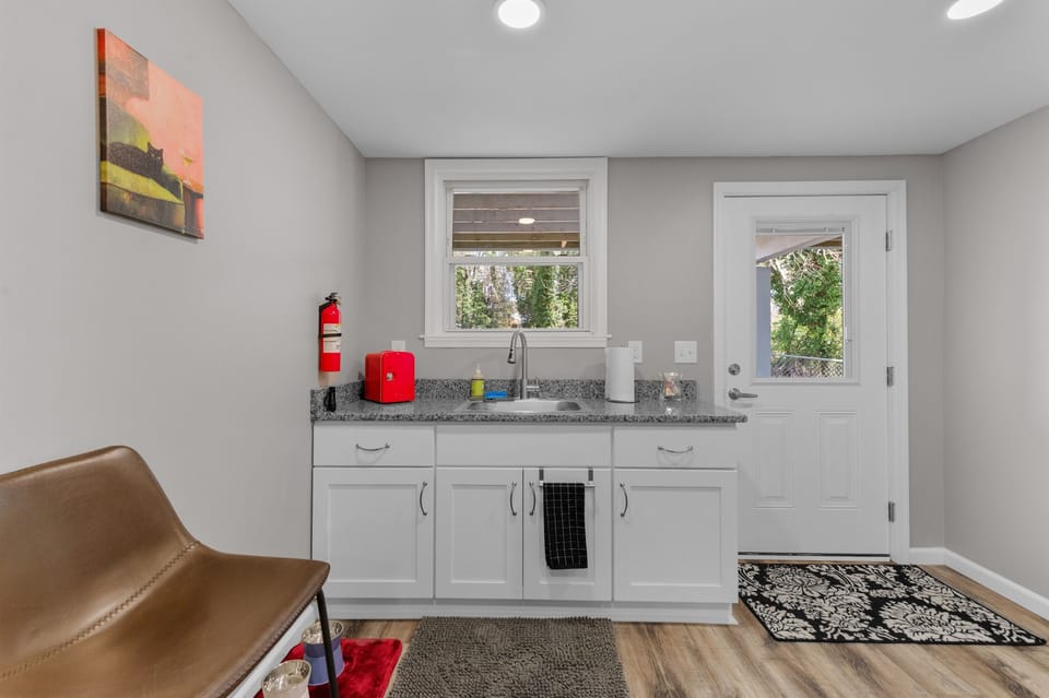 Kitchenette Delight: Whip up meals in style with modern appliances and a view of nature!