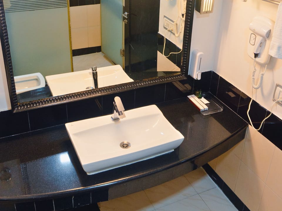 Deluxe Double Room, Mountain View | Bathroom | Hair dryer, slippers, towels, soap