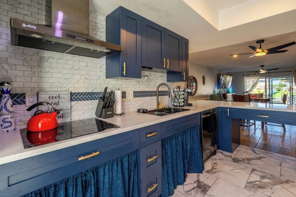 Fully accessible kitchen with roll under sink and stove top