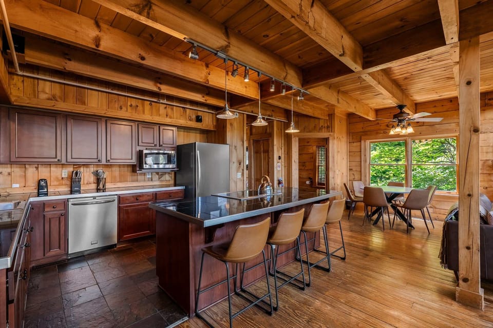 A fully equipped kitchen with granite counters and stainless appliances, ready for everything from pancakes to a holiday feast.