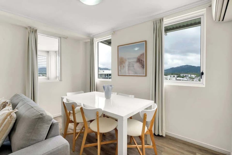 The main dining area is bright and welcoming, perfect for shared meals, morning coffee, or planning your day in Cairns.