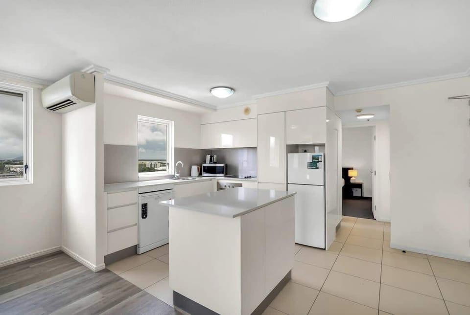 Cook with ease in the bright, modern kitchen with generous bench space, a central island, and a Nespresso machine.