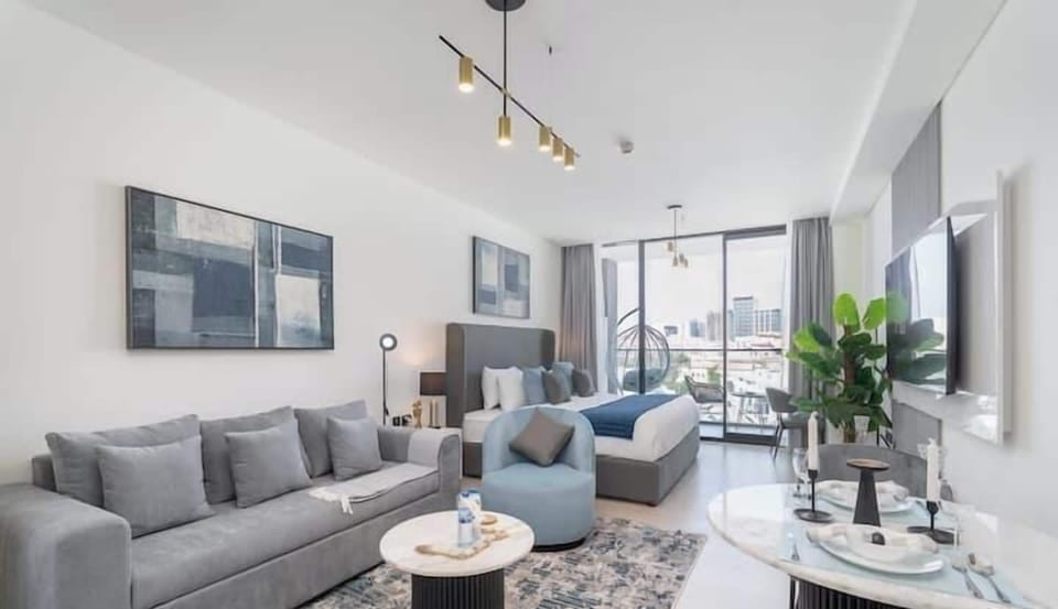 Luxury Studio, Balcony, City View | Living area | 55-inch Smart TV with cable channels