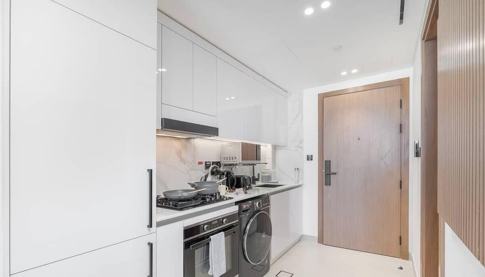 Luxury Studio, Balcony, City View | Private kitchen | Full-size fridge, microwave, stovetop, dishwasher