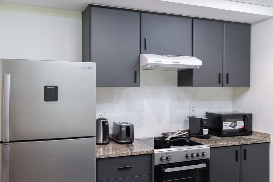 Luxury Apartment, Balcony, City View | Private kitchen | Full-size fridge, microwave, oven, stovetop