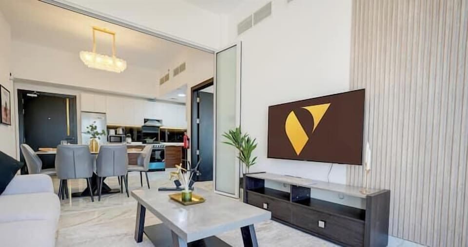 Luxury Apartment, Balcony, City View | Living area | 65-inch Smart TV with cable channels