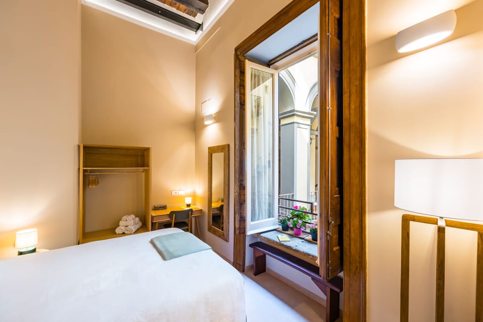 Deluxe Triple Room | In-room safe, desk, laptop workspace, blackout drapes