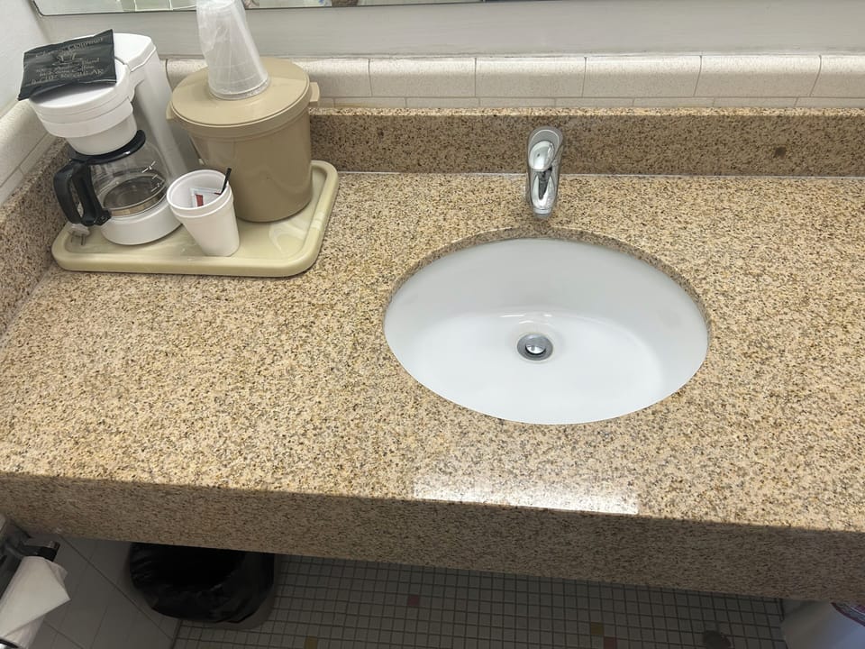 Bathtub, hair dryer, towels, soap