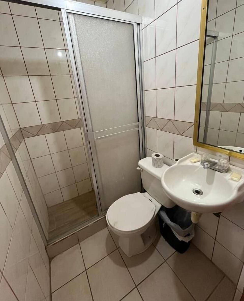 Standard Room | Bathroom | Shower, towels, toilet paper