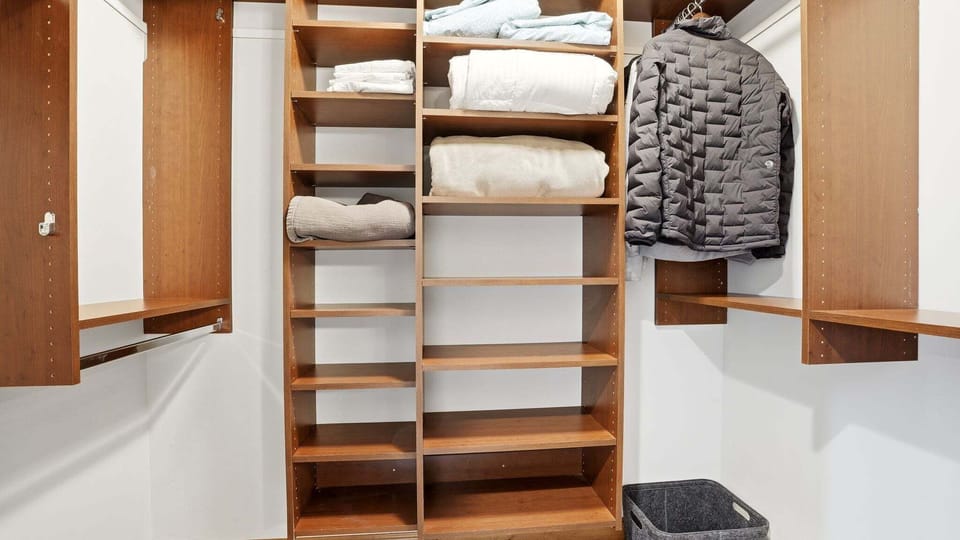 Primary bedroom walk-in closet