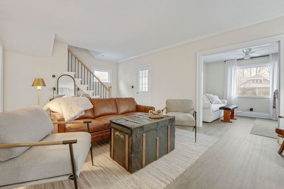 Spacious, open living area with comfortable seating and natural light throughout